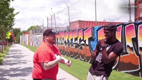 Matt in his hometown, Atlanta, signing with Shawn Self, a DEAFinitely Dope ASL consultant.