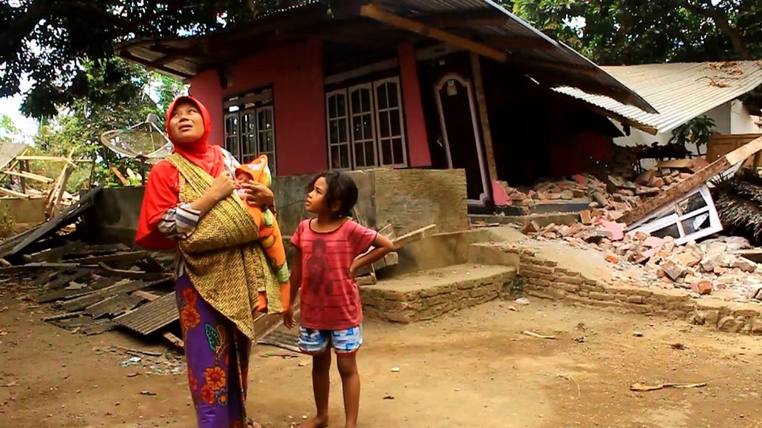 Sumiati returned to her home to survey the damage and found the roof partially collapsed.