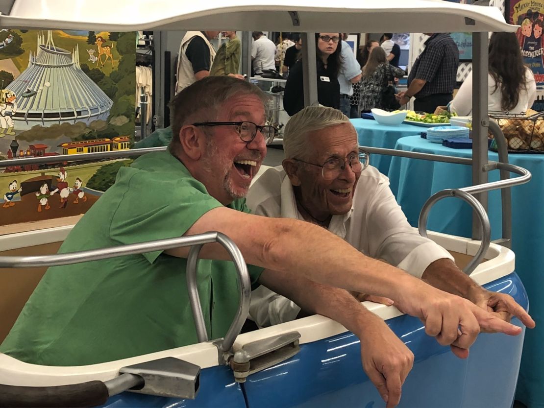 Richard Kraft (left), the collector, enjoys the exhibit's opening night with Bob Gurr, the Imagineer who designed the vehicles for most Disneyland attractions, including Autopia, the Haunted Mansion, the Monorail, the Submarine Voyage, and the Matterhorn Bobsleds. 