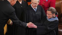 Sen. Orrin Hatch (R-UT) (L) shakes hands with U.S. Supreme Court Associate Justice Ruth Bader Ginsburg (R) as Associate Justice Stephen Breyer look son before President Barack Obama delivers the State of the Union address to a joint session of Congress in the House Chamber at the U.S. Capitol on January 28, 2014 in Washington, DC.