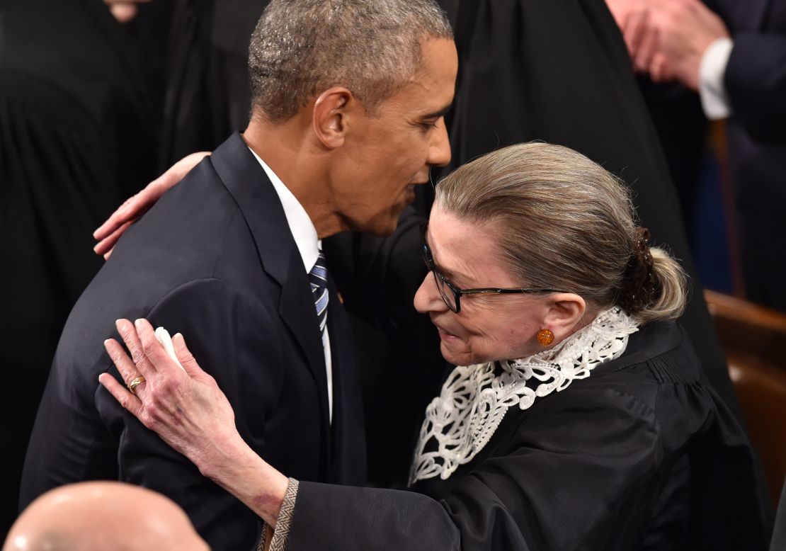 US President Barack Obama is greeted by Supreme Court Justice Ruth Bader Ginsburg as Obama arrives to deliver his State of the Union address on January 12, 2016.