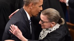 US President Barack Obama is greeted by Supreme Court Justice Ruth Bader Ginsburg as Obama arrives to deliver his State of the Union address before a Joint Session of Congress at the US Capitol in Washington, DC, on January 12, 2016.    