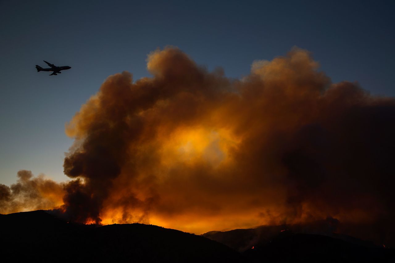 A supertanker jet flies above the Holy Fire near Lake Elsinore on August 7.