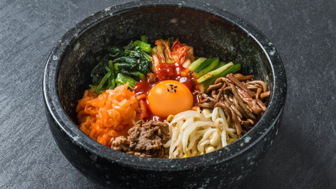 <strong>8. Bibimbap in Seoul, South Korea.</strong> There are two kinds of this perfect meal in a bowl: jeoju style. which comes in a cold bowl; and dolsot, which comes in a hot one. Either way, the ingredients mixed together are delicious. 