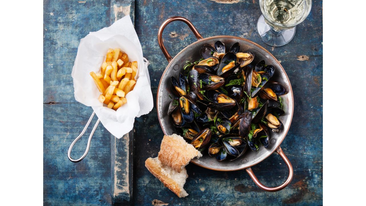 <strong>18. Moules frites in Brussels, Belgium. </strong>Belgium's national dish can be found everywhere, but head to Le Zinneke in Brussels to choose from nearly 70 variations on the menu. <br />
