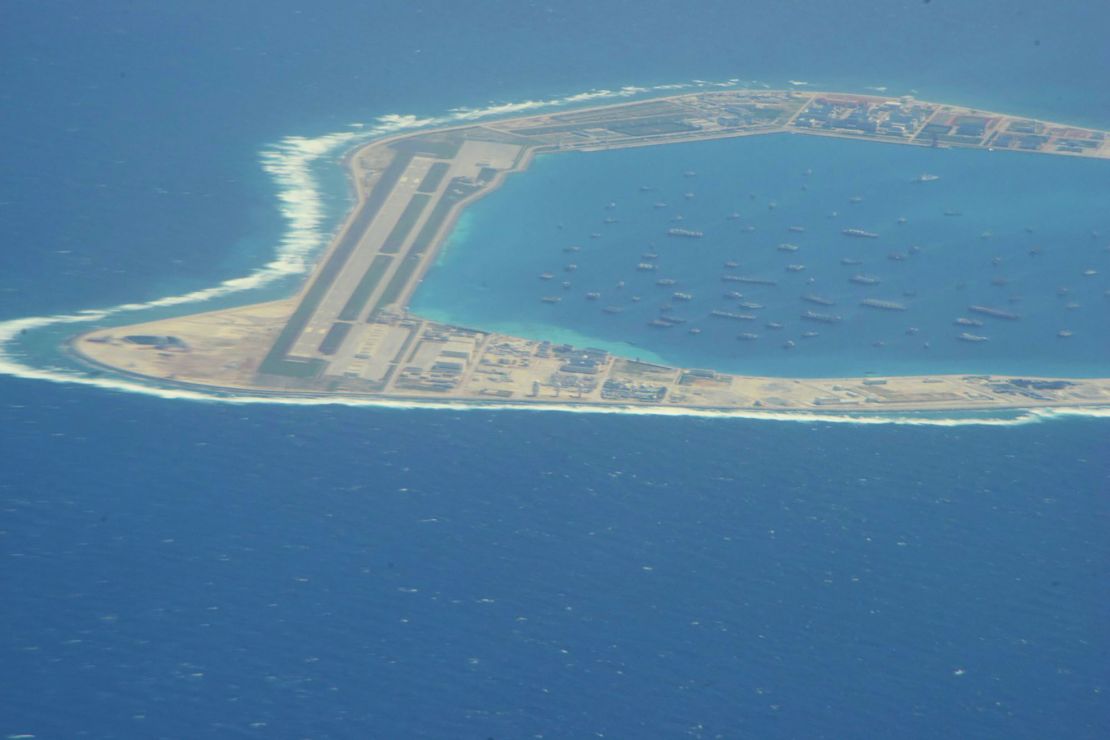 The Chinese-controlled artificial island of Mischief reef in the South China Sea, as seen by CNN from a US reconnaissance plane on August 10, with a runway and area for ships to anchor.