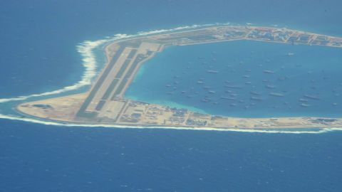 The Chinese-controlled artificial island of Mischief reef in the South China Sea, as seen by CNN from a US reconnaissance plane on August 10, with a runway and area for ships to anchor.