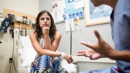 Boston, MA - 06/07/18 -- Kate Weissman meets with her oncologist Dr. Whitfield Growdon, at Massachusetts General Hospital on August 7, 2018, in Boston, Massachusetts. After a long battle with cervical cancer, fighting with her insurance company to pay for her treatment, and finally having to pay $95,000 up front for advanced photon-beam radiation therapy, Kate Weissman is cancer free - this is a follow-up appointment with her oncologist to get the all-clear. (Kayana Szymczak for CNN)