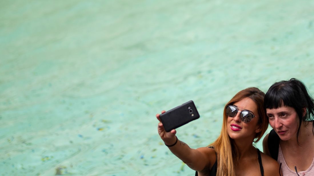 <strong>Selfie skirmish:</strong> Most Trevi Fountain selfies -- like the one pictured here -- go smoothly. But last week tourists ended up in a selfie-based skirmish after they both tried to take a picture in the same spot.