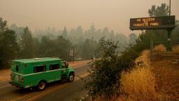 A fire transport drives along Highway 140, one of the entrances to Yosemite National Park, on Monday, July 16, 2018, in Mariposa, Calif. The road remains closed as crews battle a deadly wildfire burning near the west end of Yosemite National Park. 