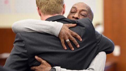 Johnson hugs one of his lawyers after the jury awarded him $289 million in damages. 