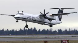 A Bombardier Dash 8 operated by Alaska Airlines Horizon Air takes off Tuesday, Jan. 26, 2016, at Seattle-Tacoma International Airport in Seattle. (AP Photo/Ted S. Warren)