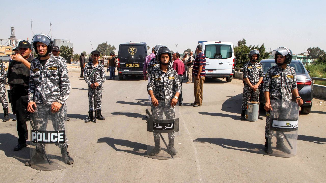 Egyptian police form a perimeter after a suicide bomber detonated an explosive belt after being denied entry to a Coptic Christian church in Mostorod on  August 11, 2018.