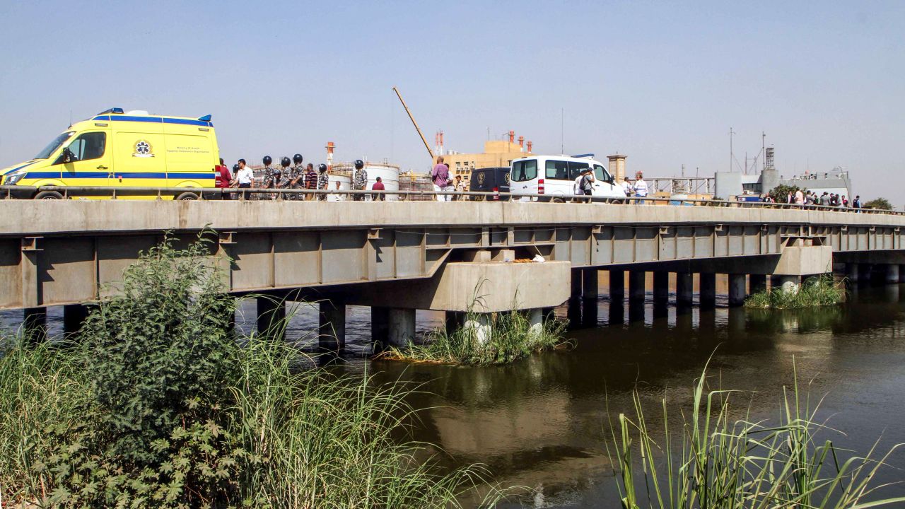 Egyptian police gather on a bridge over the Nile where a suicide bomber detonated an explosive belt after being denied entry to a Coptic Christian church.