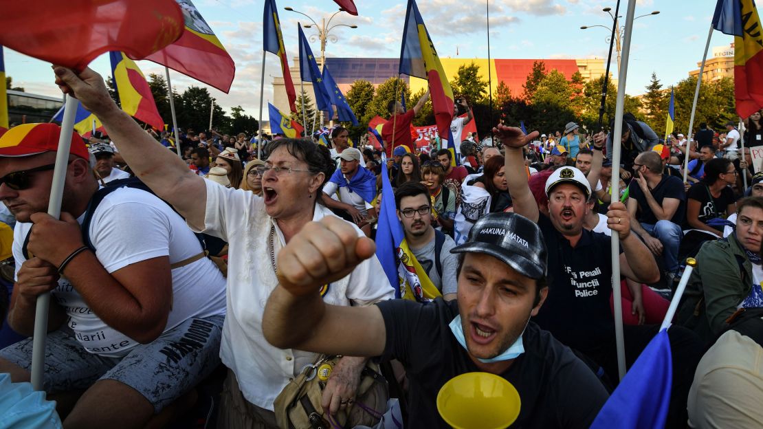 Protesters gather outside government offices in Bucharest on Saturday. 