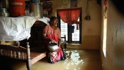 TOPSHOT - An Indian woman sits inside her houses immersed in flood waters in Ernakulam district of Kochi, in the Indian state of Kerala on August 10, 2018. - Flash floods have claimed at least 27 lives in the southern Indian state of Kerala, officials said on August 10, prompting the US to advise its citizens to stay away from the tourist hotspot. (Photo by - / AFP)        (Photo credit should read -/AFP/Getty Images)