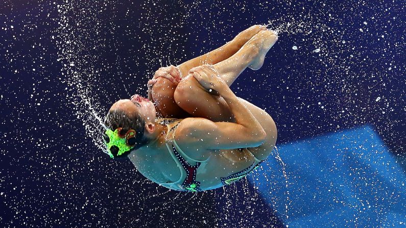 A synchronized swimmer from Italy is thrown into the air during a team routine at the European Championships on Monday, August 6.