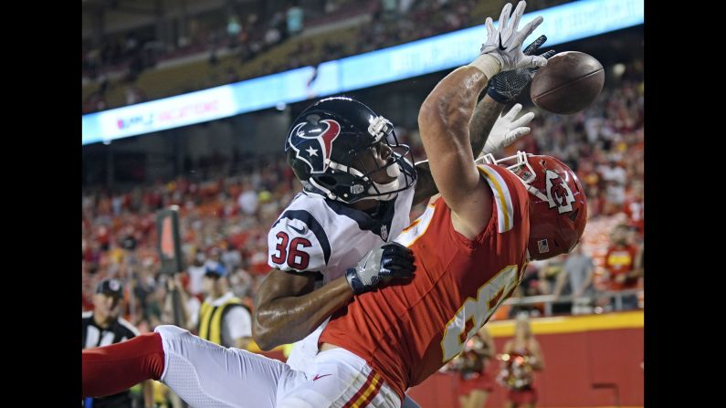 Houston's Josh Thornton, left, breaks up a pass in the end zone that was intended for Kansas City tight end Alex Ellis during an NFL preseason game on Thursday, August 9.