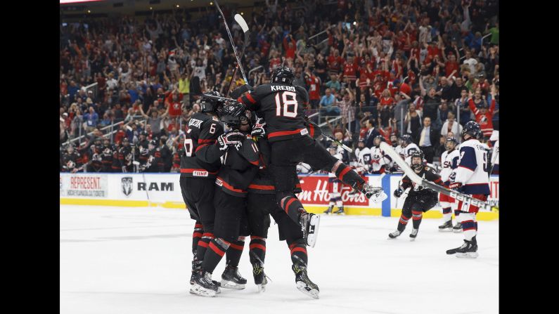 Canada celebrates the game-tying goal against the United States during the third period of a Hlinka Gretzky Cup hockey semifinal in Edmonton, Alberta, on Friday, August 10. 