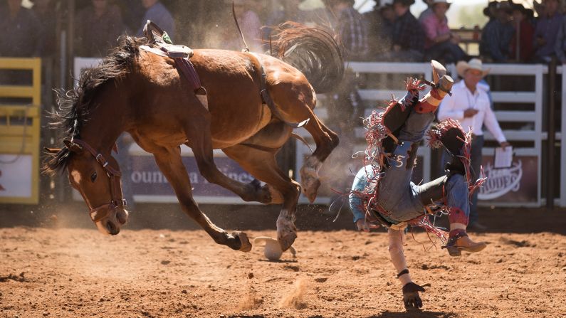 Guy Clarke is thrown from his mount as he competes in the bareback competition of the 2018 Mount Isa Mines Rotary Rodeo on Friday, August 10, in Mount Isa, Australia. 