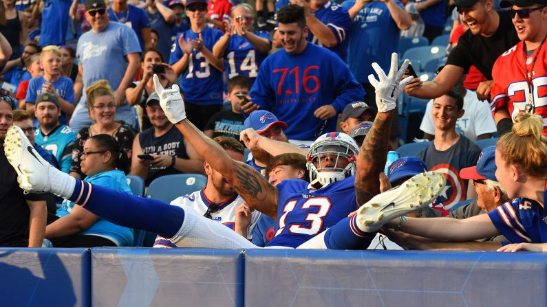 Buffalo wide receiver Kelvin Benjamin celebrates in the stands after scoring a preseason touchdown against Carolina on Thursday, August 9.