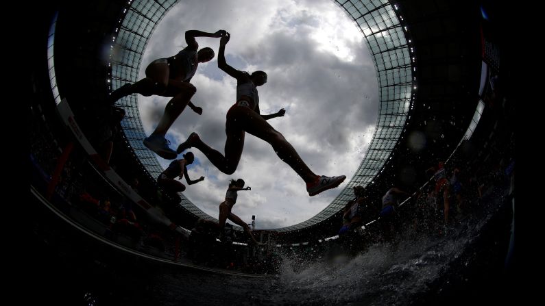 Athletes compete in a steeplechase race during the European Championships on Friday, August 10.