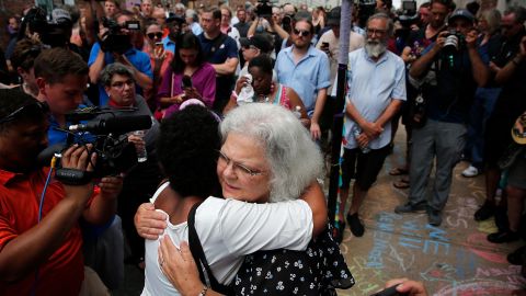 Susan Bro greets supporters near a makeshift memorial for her daughter.