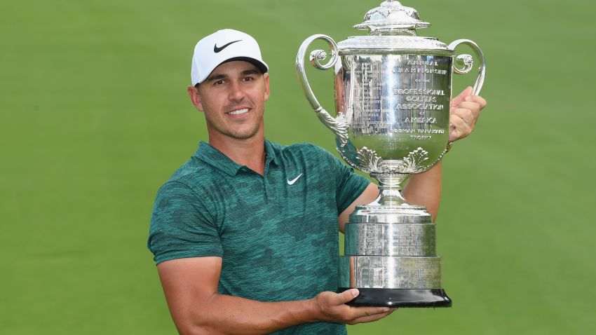 Brooks Koepka of the United States poses with the Wanamaker Trophy on the 18th green after winning the 2018 PGA Championship.