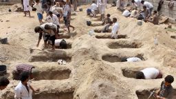 TOPSHOT - Yemenis dig graves for children, who where killed when their bus was hit during a Saudi-led coalition air strike, that targeted the Dahyan market the previous day in the Huthi rebels' stronghold province of Saada on August 10, 2018. - An attack on a bus at a market in rebel-held northern Yemen killed at least 29 children on August 9, the Red Cross said, as the Saudi-led coalition faced a growing outcry over the strike. (Photo by STRINGER / AFP)        (Photo credit should read STRINGER/AFP/Getty Images)