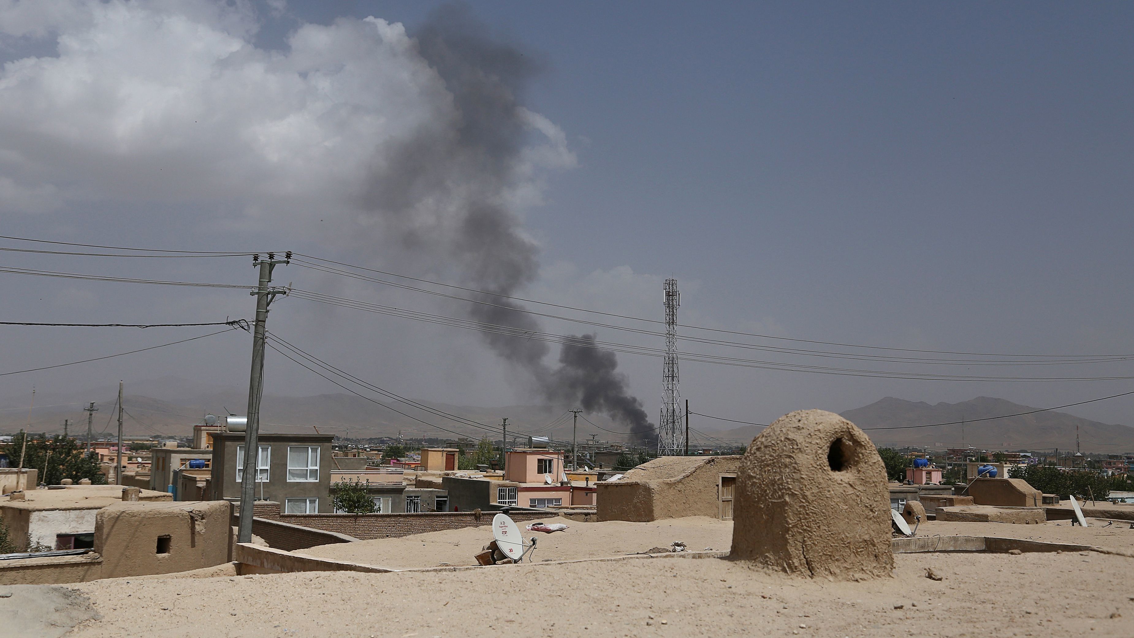 Smoke is seen rising into the air after Taliban militants launched an attack on the Afghan provincial capital of Ghazni on Friday.