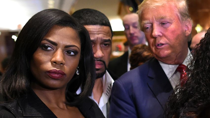 Omarosa Manigault (L)  who was a contestant on the first season of Donald Trump's "The Apprentice" and is now an ordained minister, appears alongside Republican presidential hopeful Donald Trump during a press conference November 30, 2015  that followed Trump's meeting with African-American religious leaders in New York. AFP PHOTO / TIMOTHY A. CLARY / AFP / TIMOTHY A. CLARY        (Photo credit should read TIMOTHY A. CLARY/AFP/Getty Images)