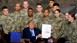 President Donald Trump signs the John McCain National Defense Authorization Act for the Fiscal Year 2019, during a signing ceremony Monday, Aug. 13, 2018, in Fort Drum, N.Y. (AP/Hans Pennink)