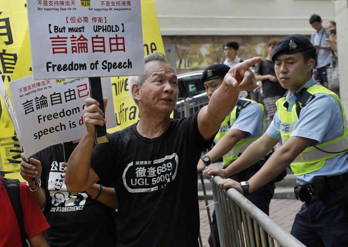 A protester shouts slogans in support of pro-independence activist Andy Chan as he delivers a speech at the Foreign Correspondents Club.