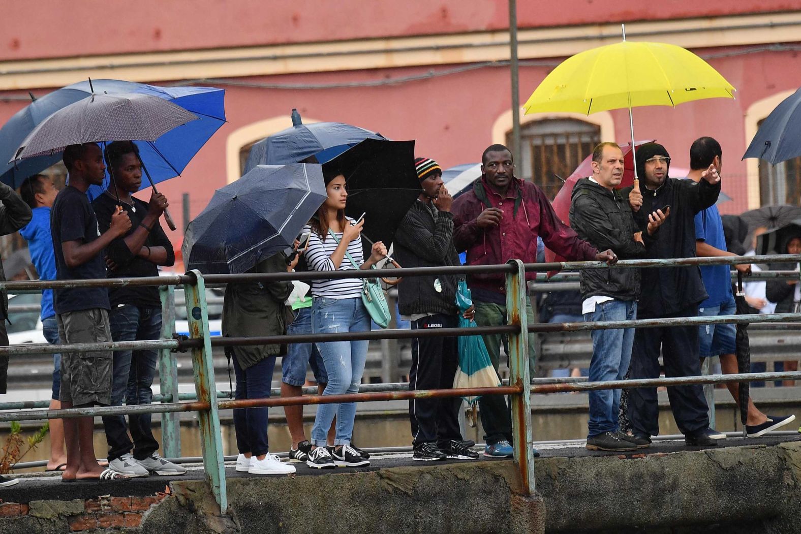 Onlookers view the collapsed bridge.