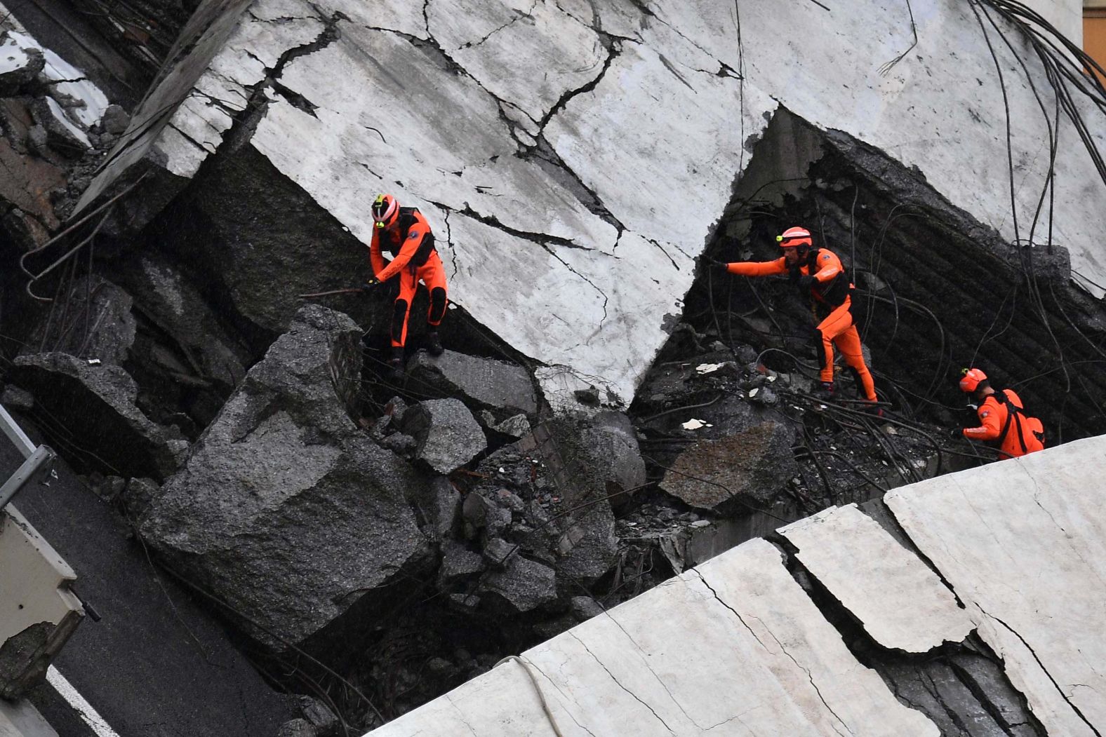 Rescuers work Tuesday amid the rubble.