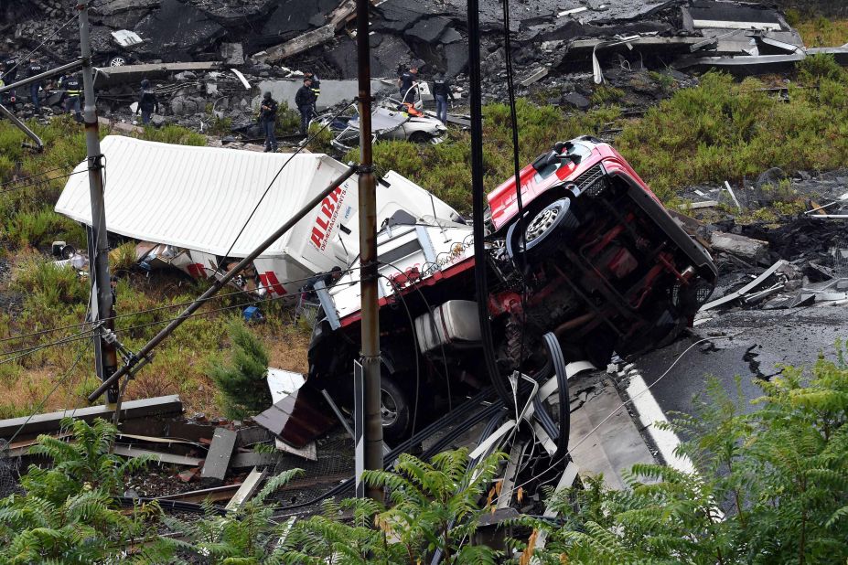 A truck is seen in the wreckage of the bridge.