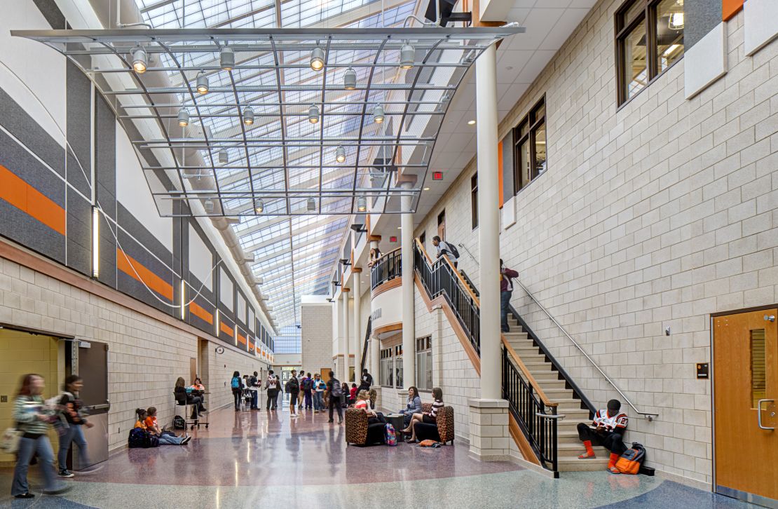 Hallways at new schools are designed to be open, collaborative spaces with clear lines of sight so that teachers and school administrators can observe.