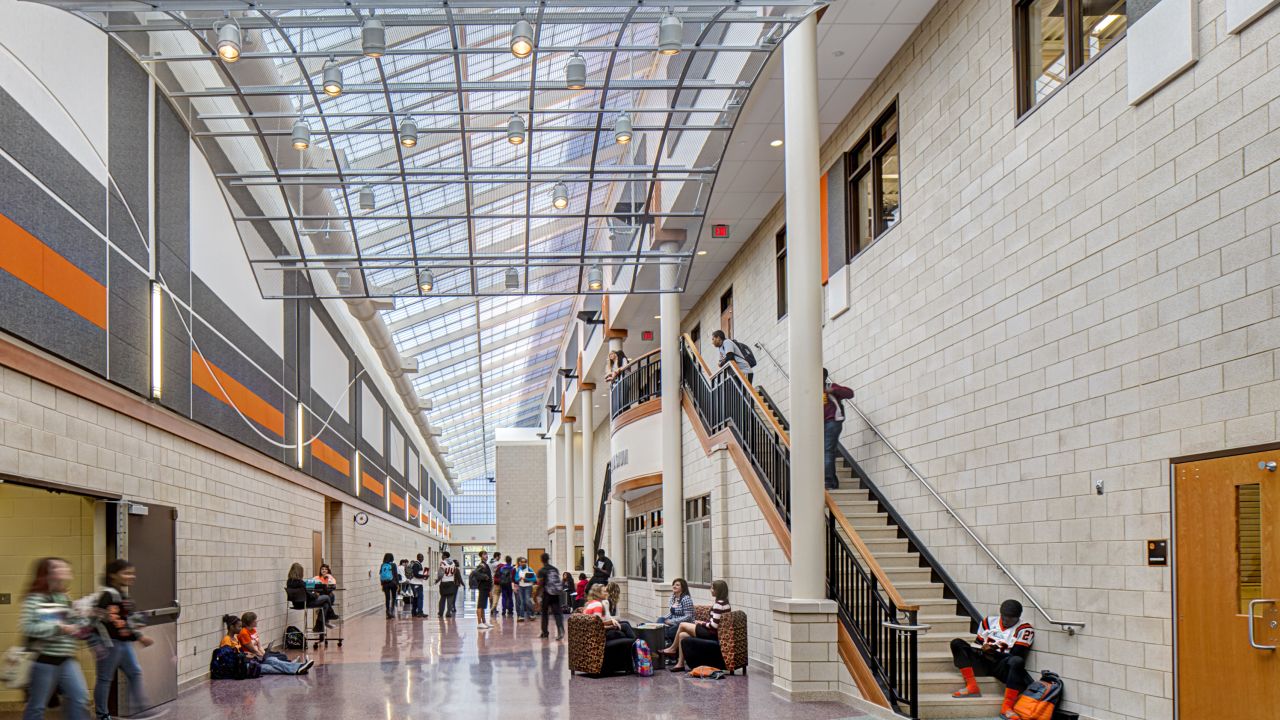 Hallways at new schools are designed to be open, collaborative spaces with clear lines of sight so that teachers and school administrators can observe.