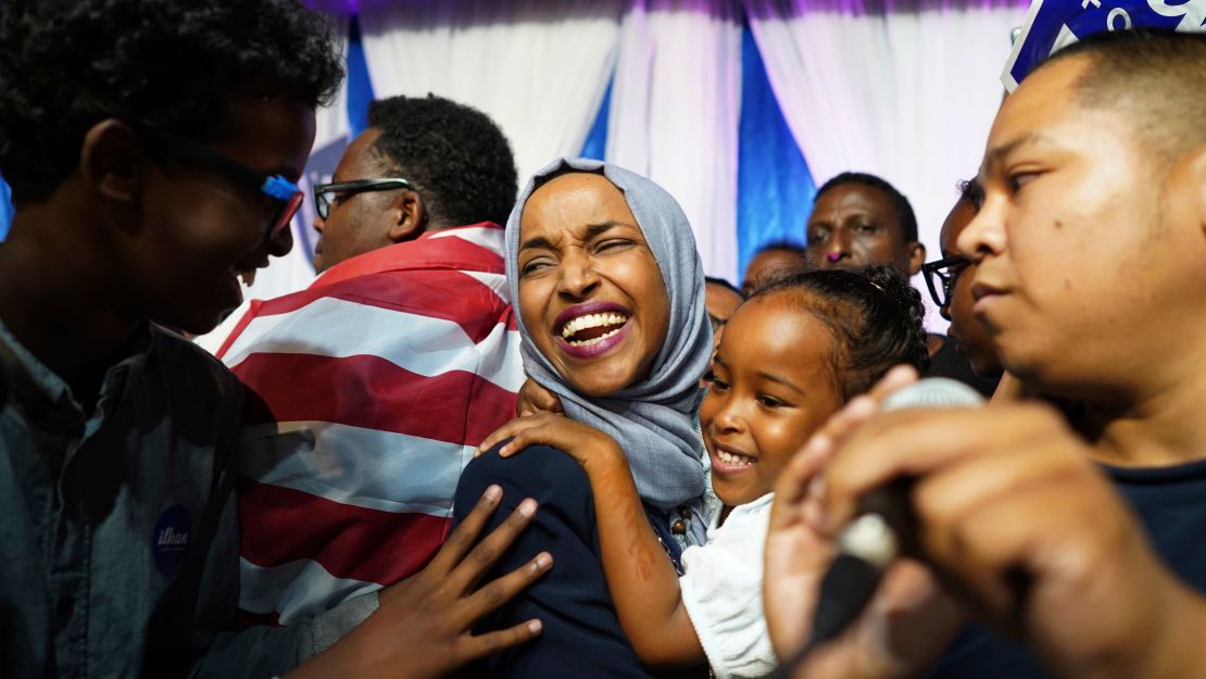 Minnesota Rep. Ilhan Omar, center, celebrates with her children after her Congressional 5th District primary victory.