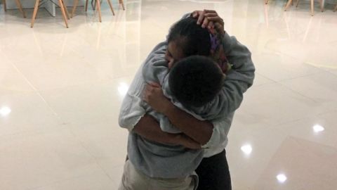 Anthony Ortiz, 9, and his mother reunite Tuesday night in their native Guatemala.
