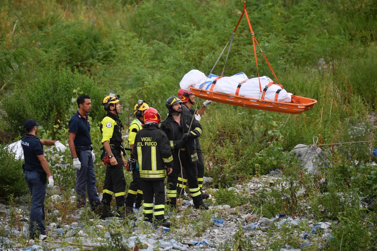 Rescuers on Tuesday recover the body of a victim.