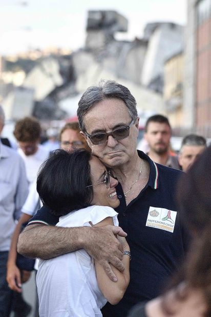 A woman is comforted at the scene.