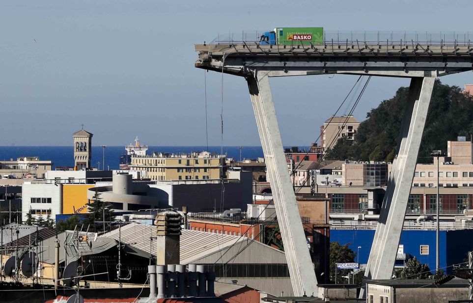 A truck is seen Wednesday, August 15, near the edge of a section of the bridge that collapsed.