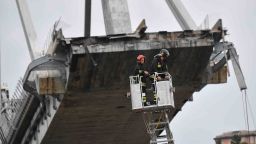Rescuers at work after a highway bridge collapsed in Genoa, Italy.
