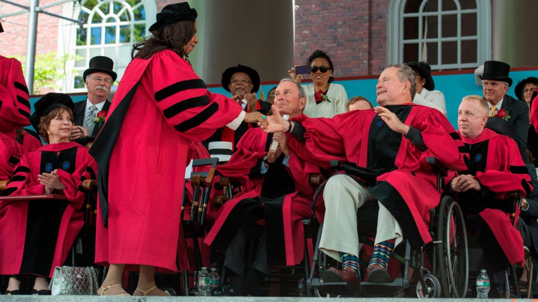 Former President George H.W. Bush congratulates Franklin after she was awarded an honorary doctorate at Harvard University commencement on May 29, 2014.