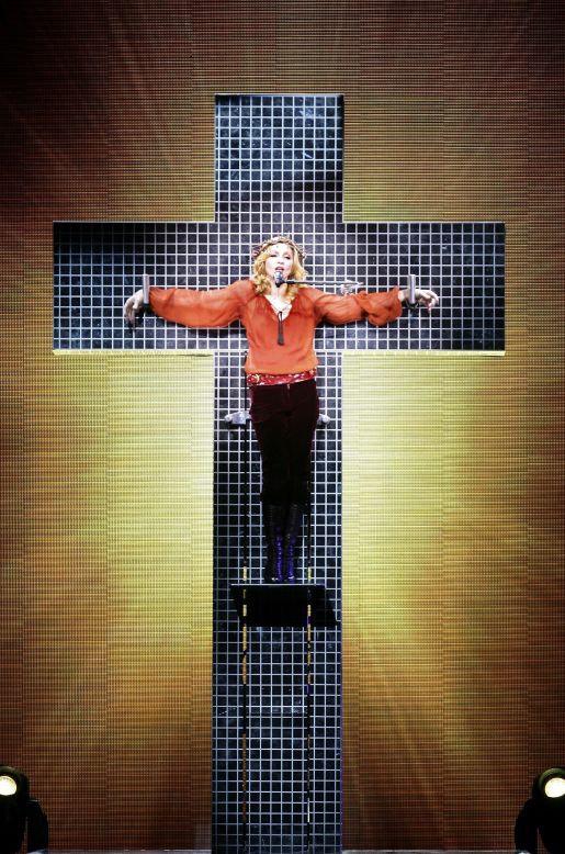 She's still into the Catholic stuff, though! In her most literal tribute to Jesus Christ yet, she belted the 1986 ballad <a href="https://www.youtube.com/watch?v=2JvK3U2gpsQ" target="_blank" target="_blank">"Live to Tell"</a> while mock-crucified to a disco-fied cross for her 2006 Confessions Tour -- once again angering the Catholic Church, as well as the Church of England. <br /><br />"I don't think Jesus would be mad at me and the message I'm trying to send," Madonna <a href="https://go.redirectingat.com/?id=30283X1542341&xs=1&isjs=1&url=https%3A%2F%2Fwww.npr.org%2Ftemplates%2Fstory%2Fstory.php%3FstoryId%3D5658956&xguid=3712f3e3b6b960bb71bfc4960fd7e16d&xuuid=2d9074866ec0028b3e3e7a136da733b7&xsessid=090b986eadd509219c52a222f5c41a78&xcreo=0&xed=0&sref=https%3A%2F%2Fwww.refinery29.uk%2F2018%2F05%2F198313%2Fmadonna-most-iconic-outfits-catholicism%23slide-6&xtz=-60&jv=13.7.1&bv=2.5.1" target="_blank" target="_blank">told the Daily News</a> of the incident.