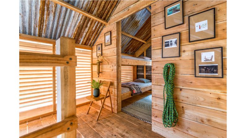 <strong>Stay overnight:</strong> Surrounded on all sides by trees, the cabin features a spacious deck, hanging birdcage  chairs, and several bedrooms that can sleep up to six people. Travelers can book the lodge on Airbnb, then enjoy an off-grid getaway.