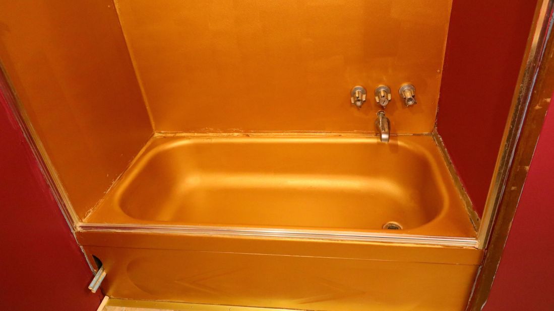 <strong>Gold bathroom:</strong> The mobile home has been carefully restored to reflect how it would have been back when Elvis first signed the ownership papers in 1967. "It was finished with gold lead paint in the restroom which is typical of Elvis fashion," says Kruse. 