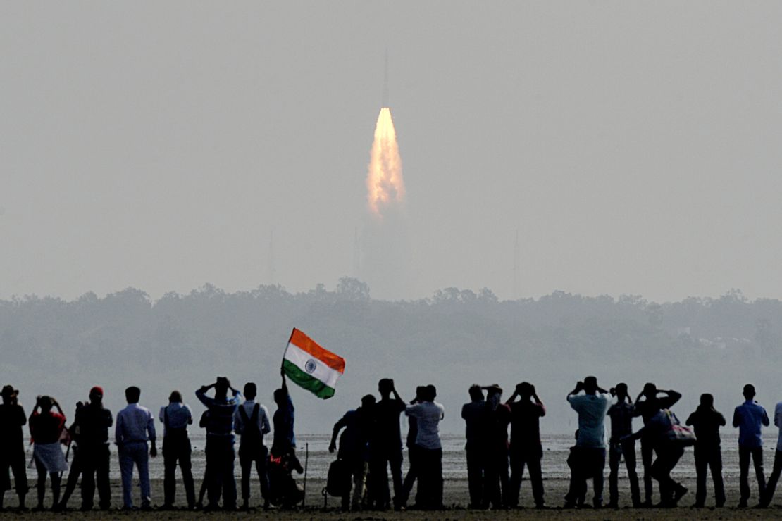 Onlookers watch the launch of the Indian Space Research Organisation (ISRO) Polar Satellite Launch Vehicle (PSLV-C37) at Sriharikota on February 15, 2017.