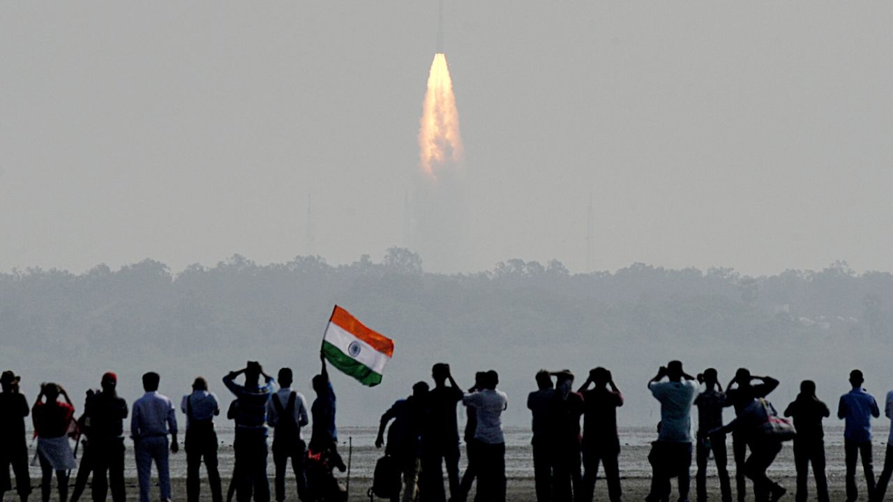 Onlookers watch the launch of the Indian Space Research Organisation (ISRO) Polar Satellite Launch Vehicle (PSLV-C37) at Sriharikota on February 15, 2017.
